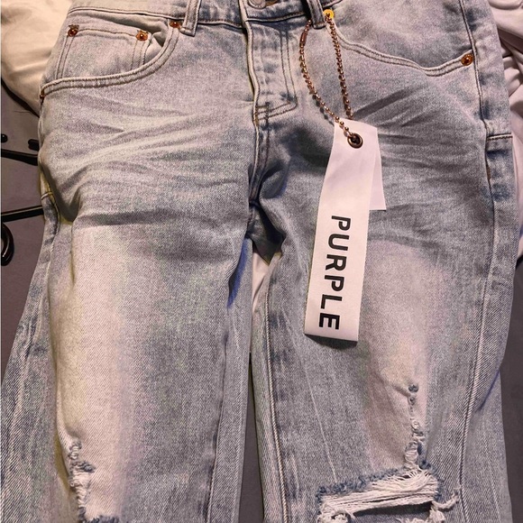 Slim Blue Distressed Jeans with Rips and Vintage Fading